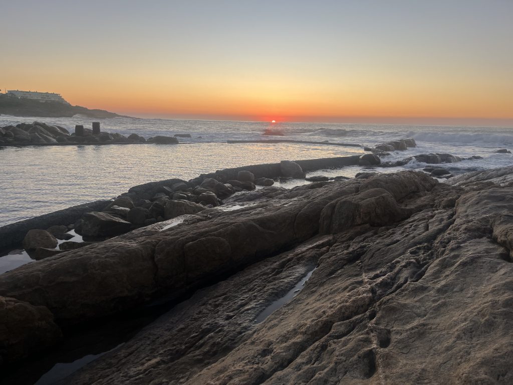 Peaceful sunrise over the Ramsgate KZN shoreline and rock pool near SCRC, providing a serene setting for addiction treatment in South Africa.