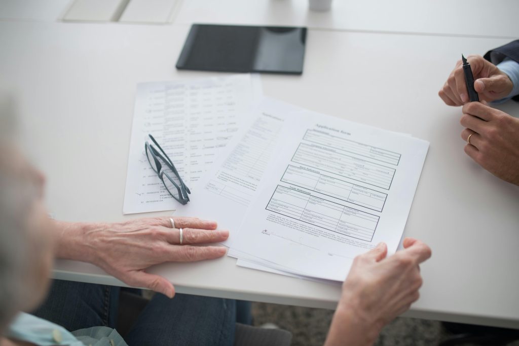 Client completing addiction treatment admission forms with guidance from the SCRC team.
