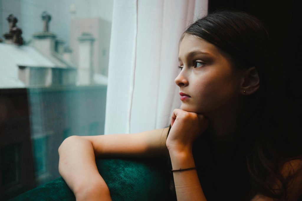 Individual reflecting on the emotional toll of alcohol addiction before beginning treatment at SCRC.